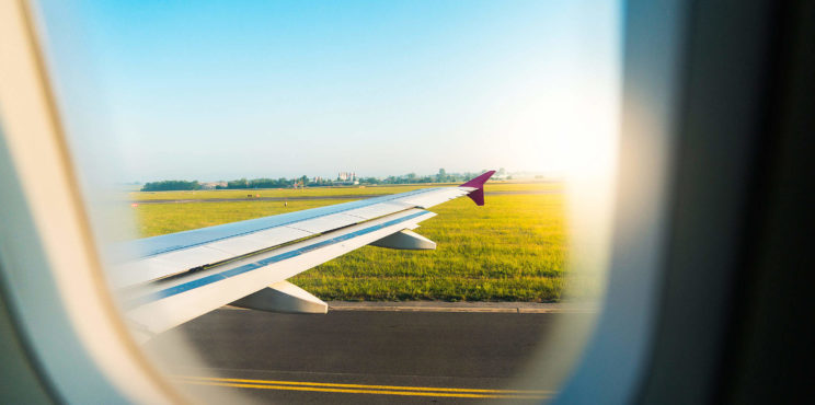 Airplane Wing Through Window During Take Off